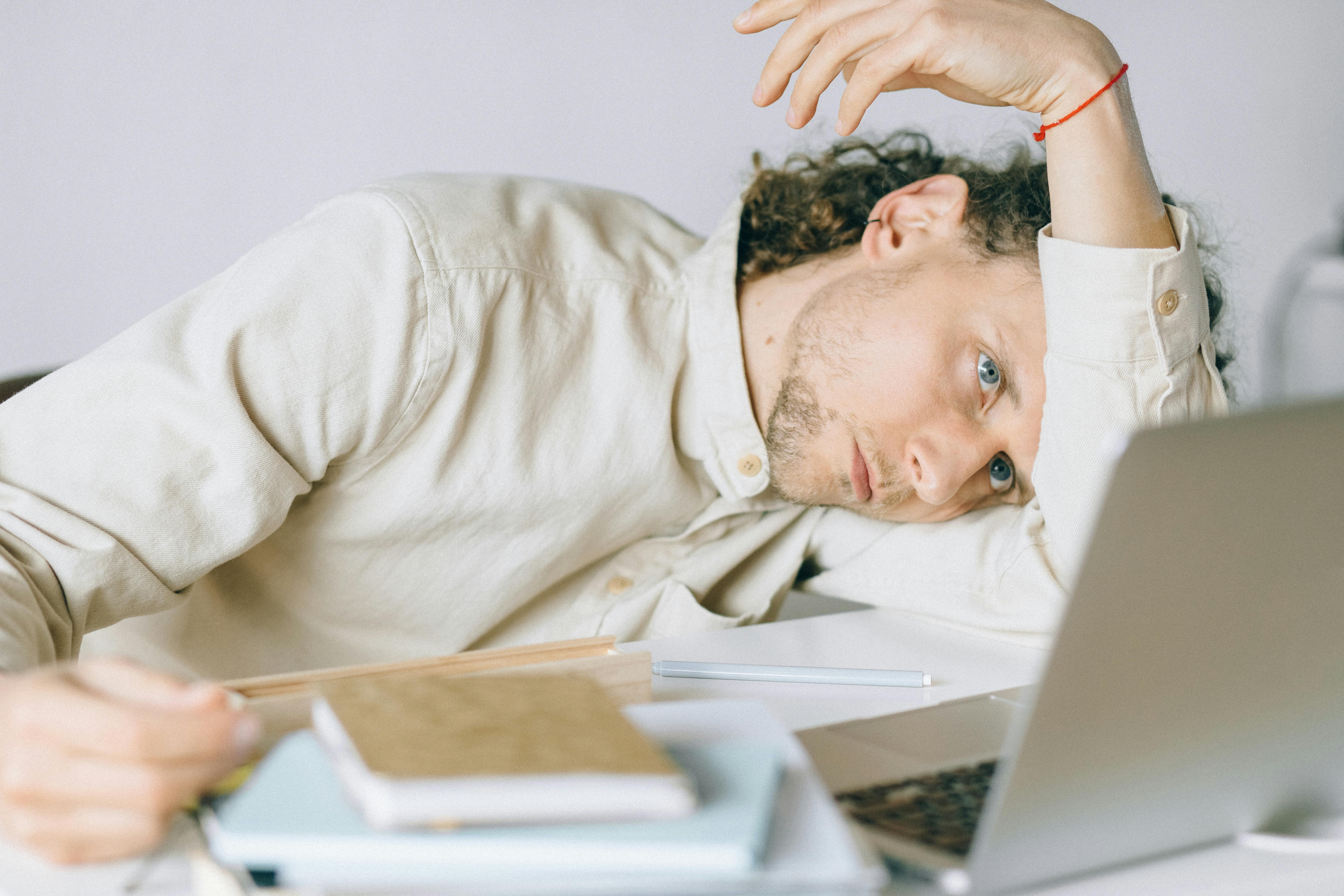 Overworked employee | Source: Pexels