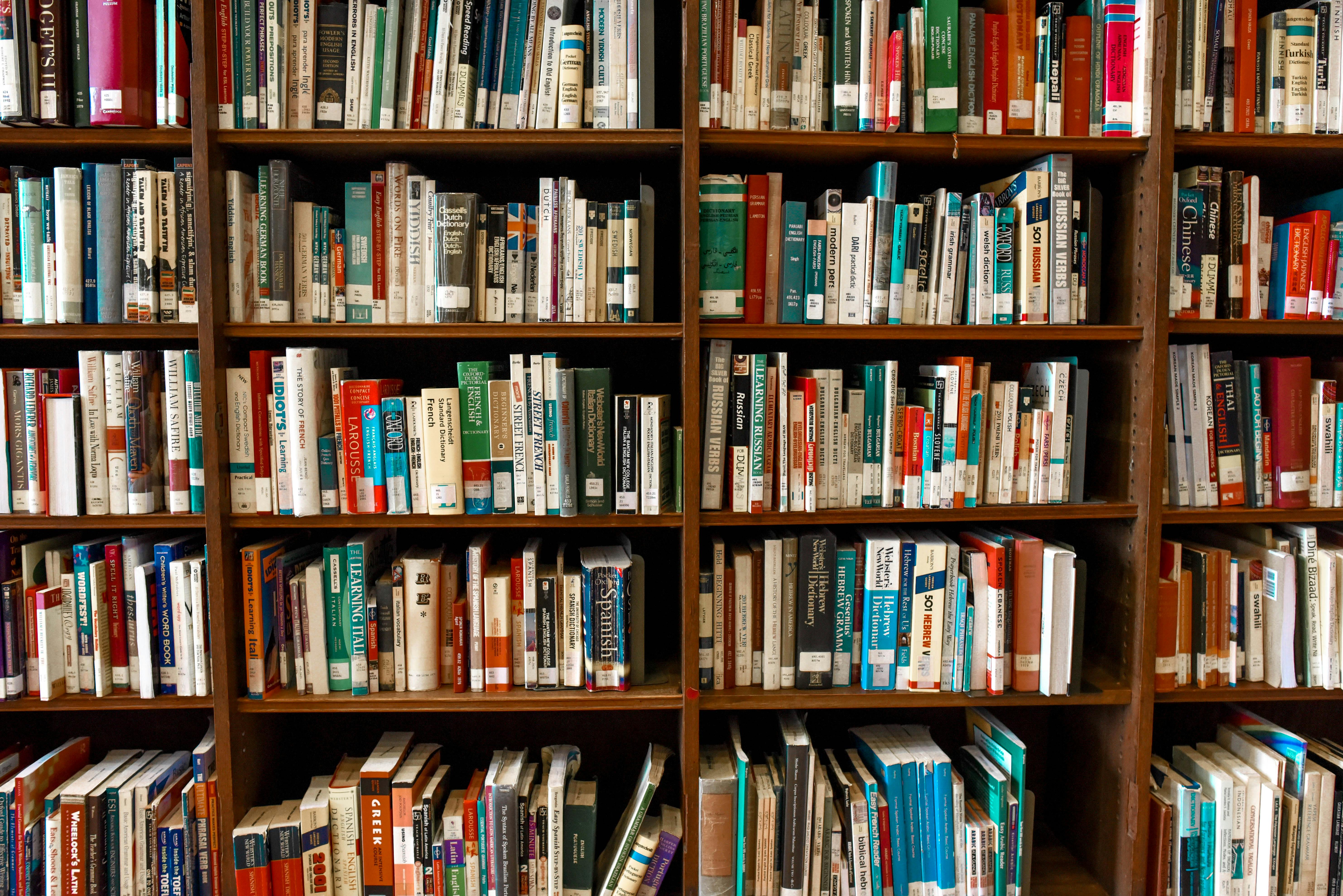 Assorted books on bookshelves | Source: Pexels