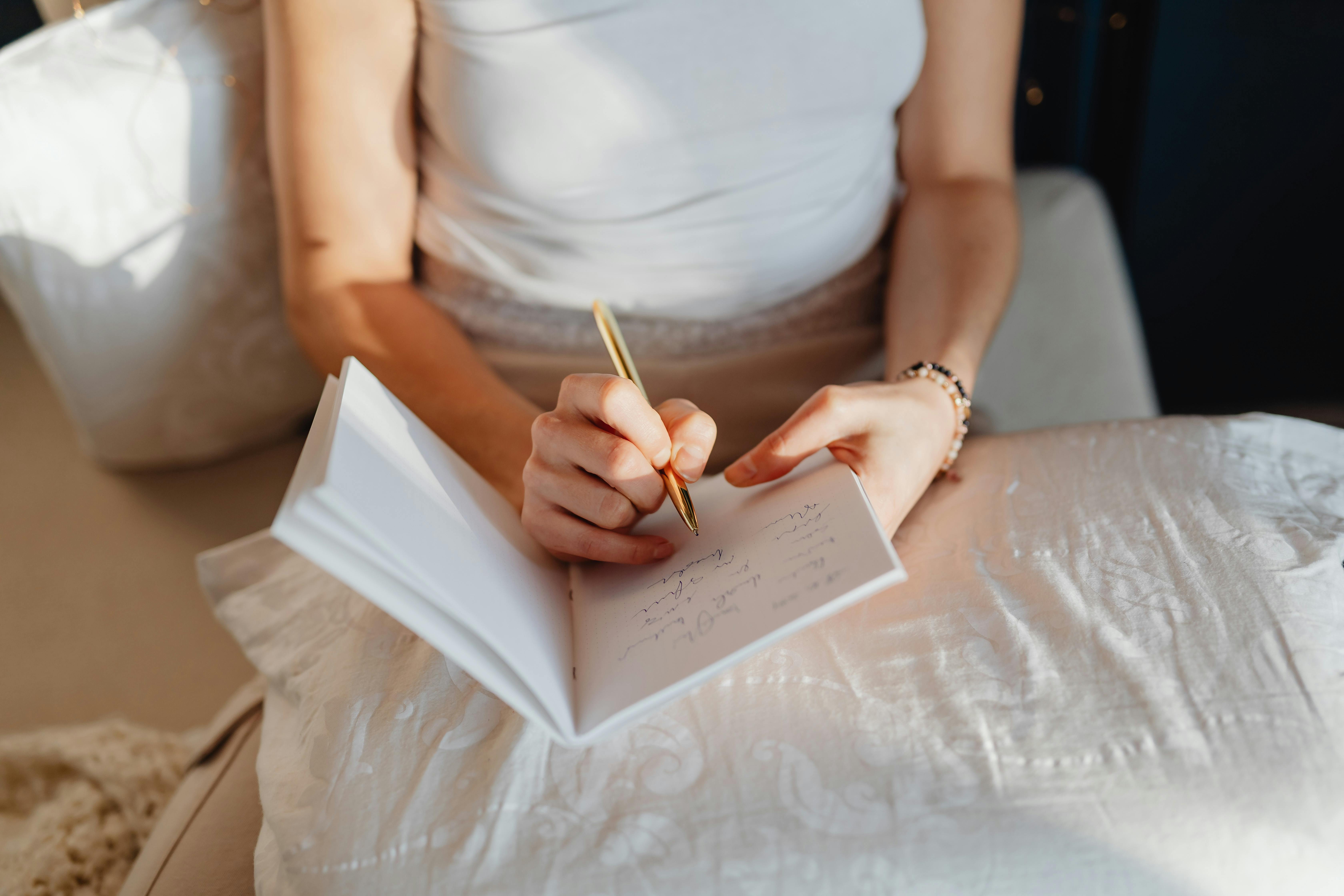 Woman journaling | Source: Pexels