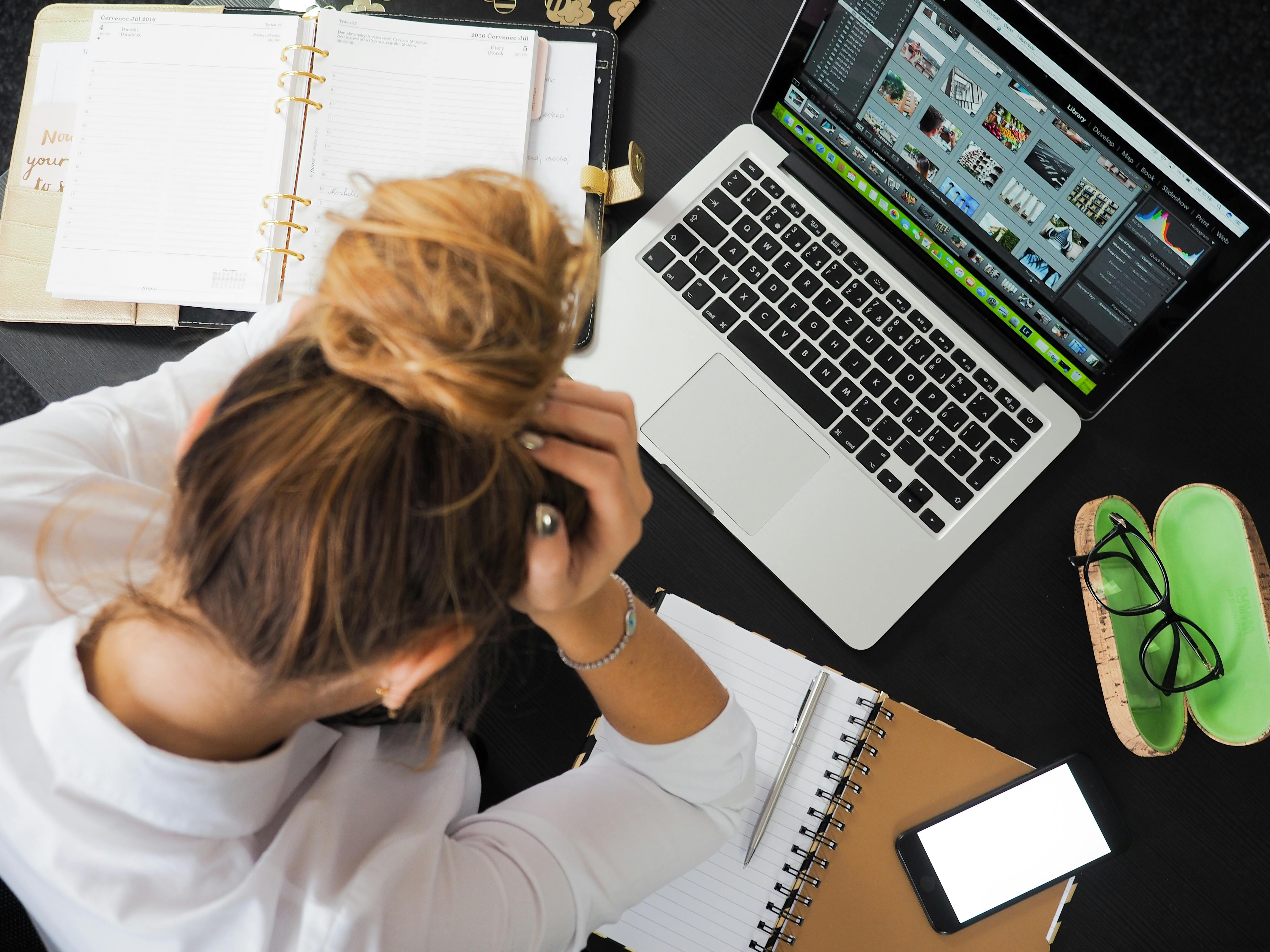 Woman sitting in front of Macbook | Source: Pexels