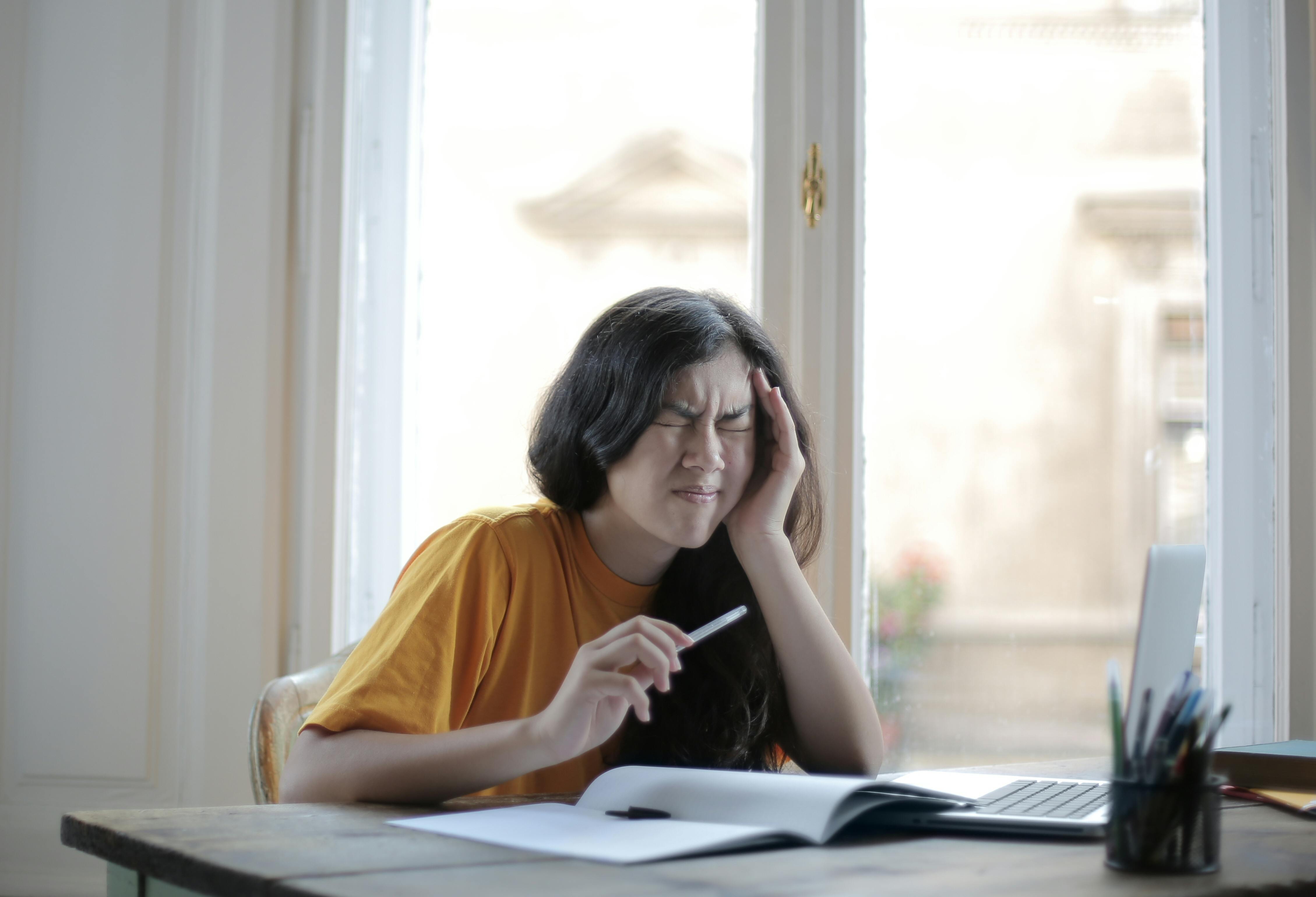 Woman suffering from headache | Source: Pexels