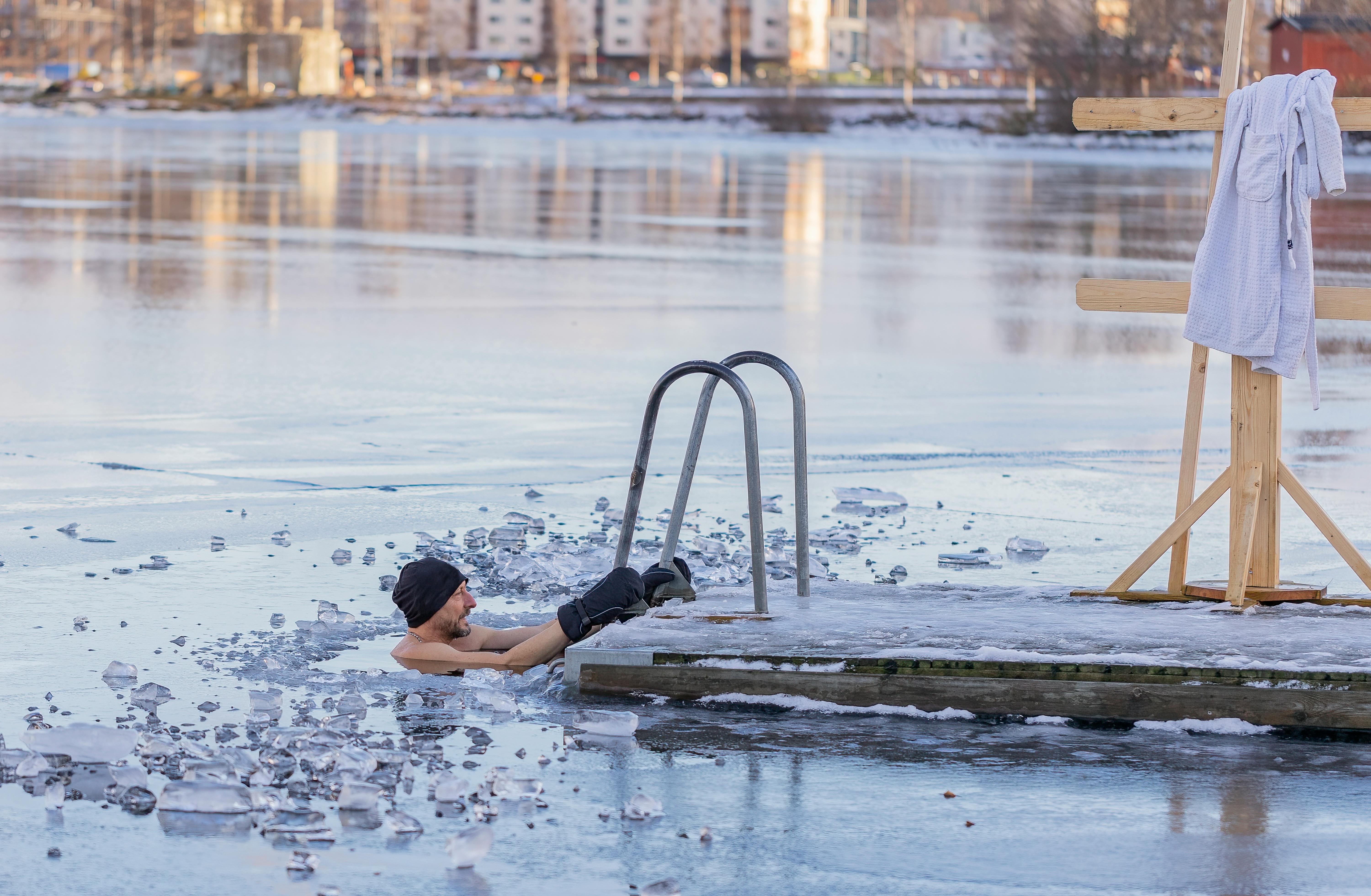 Man in a frozen lake | Source: Pexels