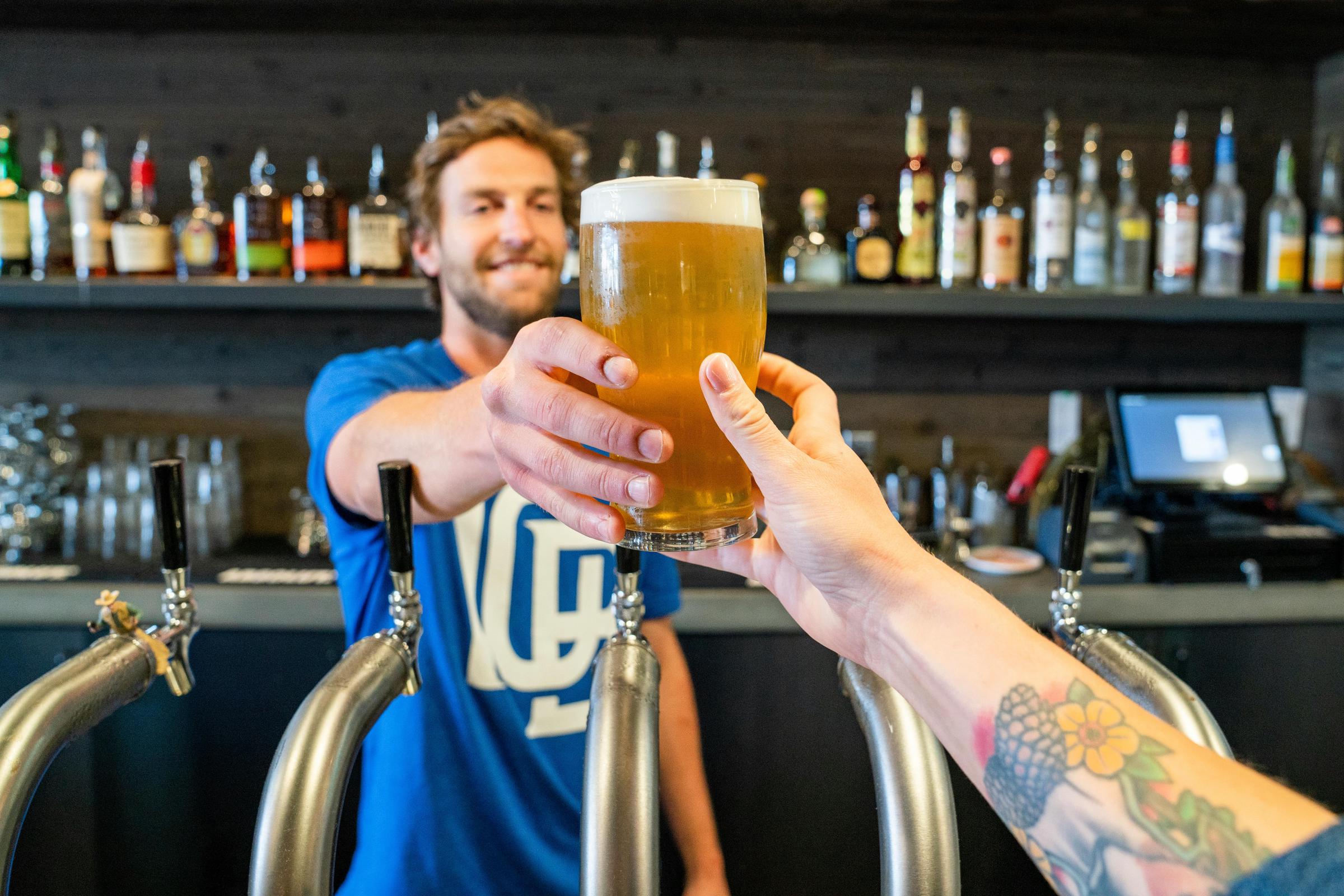 Person getting a beer | Source: Pexels